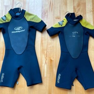 Two Stohlquist kids shortie wetsuits